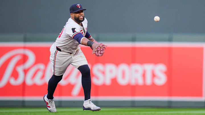 Aug 12, 2024; Minneapolis, Minnesota, USA; Minnesota Twins first base Carlos Santana (30) throws to first base against the Kansas City Royals in the third inning at Target Field. Mandatory Credit: Brad Rempel-Imagn Images
