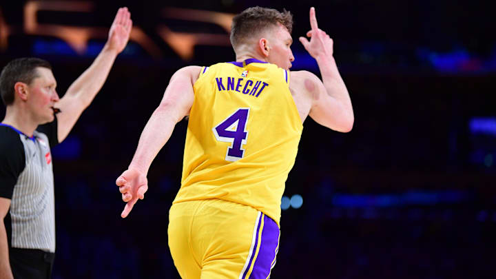 Mar 6, 2025; Los Angeles, California, USA; Los Angeles Lakers guard Dalton Knecht (4) reacts after scoring a three point basket against the New York Knicks during the second half at Crypto.com Arena. Mandatory Credit: Gary A. Vasquez-Imagn Images