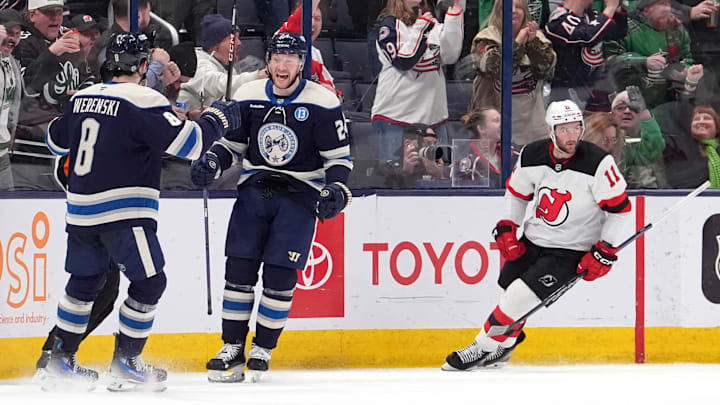 Blue Jackets Zach Werenski and Mathieu Olivier celebrate a goal against the New Jersey Devils last season. 