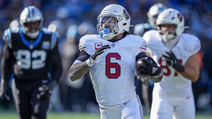 Dec 22, 2024; Charlotte, North Carolina, USA; Arizona Cardinals running back James Conner (6) runs for yardage against the Carolina Panthers during the second quarter at Bank of America Stadium. Mandatory Credit: Jim Dedmon-Imagn Images