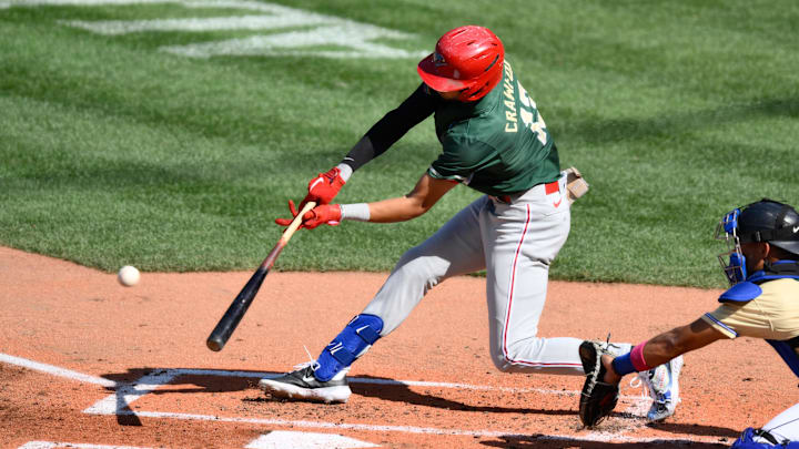 Jul 8, 2023; Seattle, Washington, USA; National League Futures designated hitter Justin Crawford (13) of the Philadelphia Phillies hits an RBI sacrifice fly against the American League during the second inning of the All Star-Futures game at T-Mobile Park. 