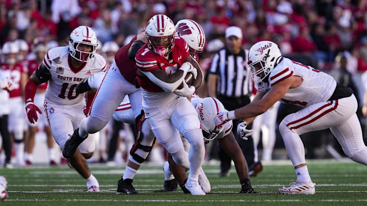 Sep 7, 2024; Madison, Wisconsin, USA; Wisconsin Badgers running back Dilin Jones (7) during the game against the South Dakota Coyotes at Camp Randall Stadium. Mandatory Credit: Jeff Hanisch-Imagn Images Sep 7, 2024; Madison, Wisconsin, USA; Wisconsin Badgers running back Dilin Jones (7) during the game against the South Dakota Coyotes at Camp Randall Stadium. Mandatory Credit: Jeff Hanisch-Imagn Images