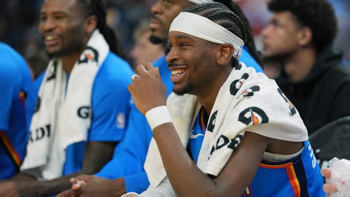 Jan 2, 2026; San Francisco, California, USA; Oklahoma City Thunder guard Shai Gilgeous-Alexander (center) sits on the bench during the second quarter against the Golden State Warriors at Chase Center. Mandatory Credit: Darren Yamashita-Imagn Images