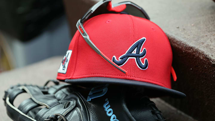 wMar 1, 2025; North Port, Florida, USA; A detail view of Atlanta Braves hat, sunglasses and glove in the dugout during the fifth inning at CoolToday Park. Mandatory Credit: Kim Klement Neitzel-Imagn Images wMar 1, 2025; North Port, Florida, USA; A detail view of Atlanta Braves hat, sunglasses and glove in the dugout during the fifth inning at CoolToday Park. Mandatory Credit: Kim Klement Neitzel-Imagn Images