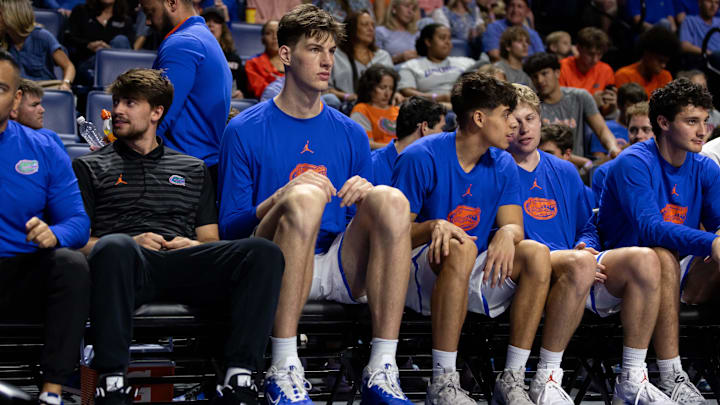 Florida Gators center Olivier Rioux (32) sits on the bench against the Jacksonville Dolphins during the first half at Exactech Arena at the Stephen C. O'Connell Center. Florida Gators center Olivier Rioux (32) sits on the bench against the Jacksonville Dolphins during the first half at Exactech Arena at the Stephen C. O'Connell Center.