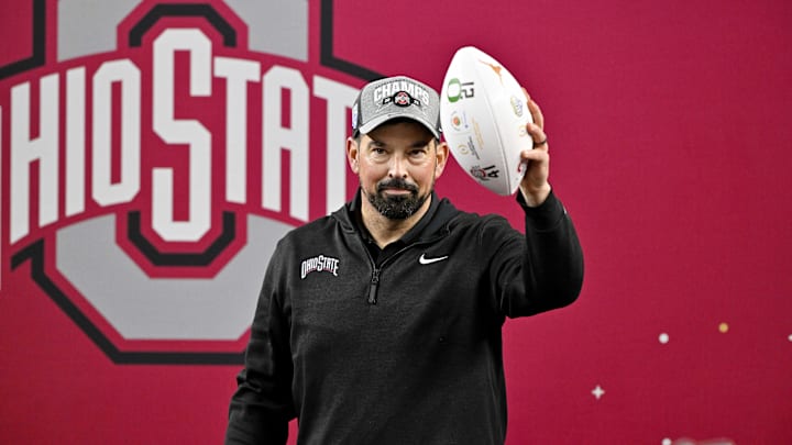 Ohio State Buckeyes head coach Ryan Day holds up the game ball after the Buckeyes defeat the Texas Longhorns at AT&T Stadium.