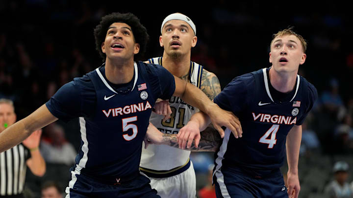 Virginia forward Jacob Cofie (5) and guard Andrew Rohde (4) get position on Georgia Tech's Duncan Powell in the ACC tourney.