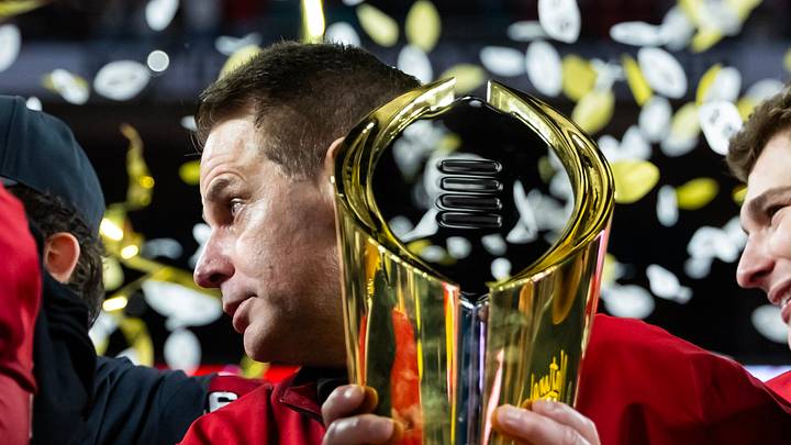 Jan 19, 2026; Miami Gardens, FL, USA; Indiana Hoosiers head coach Curt Cignetti hoists the trophy as he celebrates after defeating the Miami Hurricanes in the College Football Playoff National Championship game at Hard Rock Stadium. Mandatory Credit: Mark J. Rebilas-Imagn Images Jan 19, 2026; Miami Gardens, FL, USA; Indiana Hoosiers head coach Curt Cignetti hoists the trophy as he celebrates after defeating the Miami Hurricanes in the College Football Playoff National Championship game at Hard Rock Stadium. Mandatory Credit: Mark J. Rebilas-Imagn Images