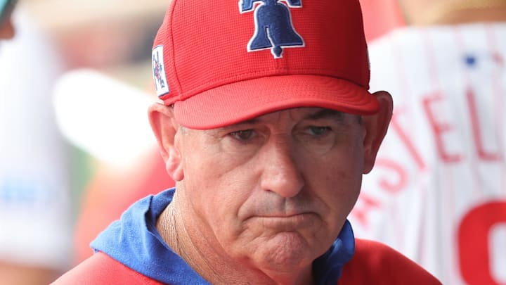 Mar 24, 2025; Clearwater, Florida, USA;  Philadelphia Phillies manager Rob Thomson (59) looks on in the dugout against the Tampa Bay Rays during the third inning at BayCare Ballpark. Mandatory Credit: Kim Klement Neitzel-Imagn Images