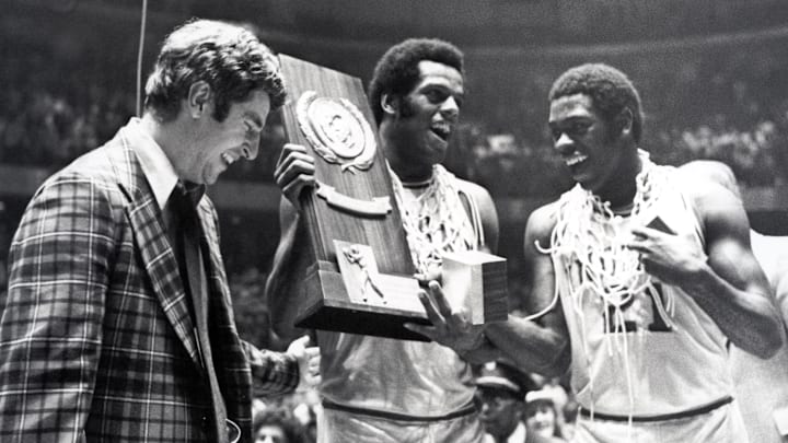 Mar 29, 1976; Philadelphia, PA; Indiana head coach Bobby Knight, forward Scott May, and guard Quinn Buckner (21) celebrate after winning the 1976 NCAA basketball championship. The Hoosiers beat the Wolverines 86-68.