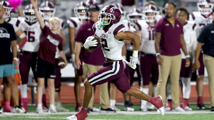 Jenks' Kaydin Jones runs for a touchdown during the high school football game between Norman North and Jenks at Harve Collins Field in Norman, Okla., Thursday, Oct. 5, 2023.