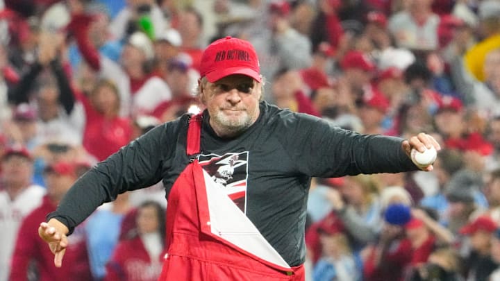 Former Philadelphia Phillies player Kruk throws a ceremonial first pitch.
