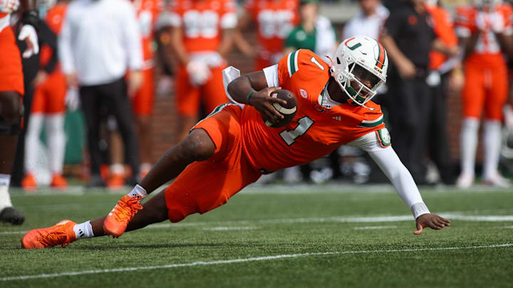 Nov 9, 2024; Atlanta, Georgia, USA; Miami Hurricanes quarterback Cam Ward (1) dives against the Georgia Tech Yellow Jackets in the second quarter at Bobby Dodd Stadium at Hyundai Field. Mandatory Credit: Brett Davis-Imagn Images