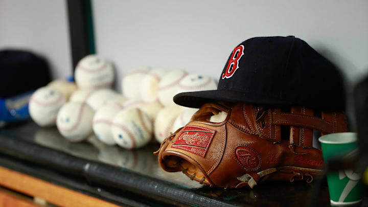 Jun 28, 2015; St. Petersburg, FL, USA; Boston Red Sox hat and glove lay in the dugout against the Tampa Bay Rays at Tropicana Field. Mandatory Credit: Kim Klement-Imagn Images
