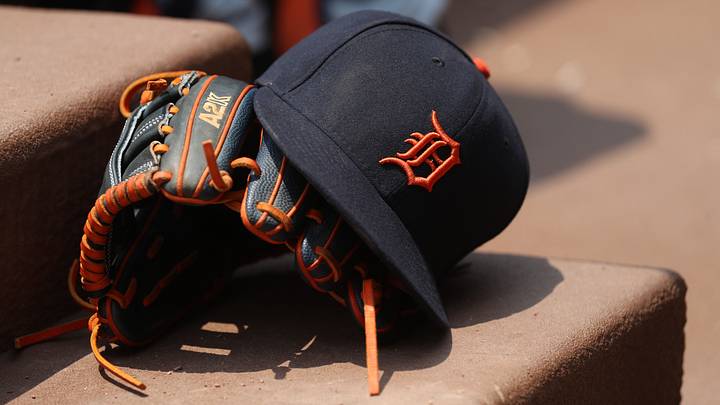A Detroit Tigers hat and glove. A Detroit Tigers hat and glove.