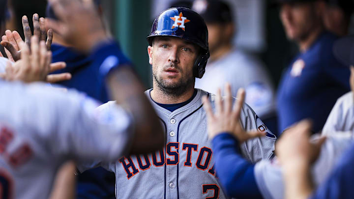Sep 4, 2024; Cincinnati, Ohio, USA; Houston Astros third baseman Alex Bregman (2) high fives teammates after scoring on a RBI single hit by outfielder Ben Gamel (not pictured) in the second inning against the Cincinnati Reds at Great American Ball Park. Mandatory Credit: Katie Stratman-Imagn Images