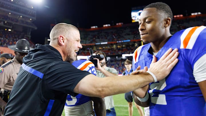 Oct 18, 2025; Gainesville, Florida, USA; Florida Gators head coach Billy Napier celebrates with quarterback DJ Lagway (2) after a game against the Mississippi State Bulldogs at Ben Hill Griffin Stadium. Mandatory Credit: Matt Pendleton-Imagn Images