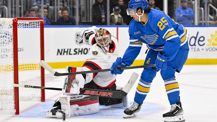 Oct 2, 2025; St. Louis, Missouri, USA; Ottawa Senators goaltender Leevi Meriläinen (1) defends the net against St. Louis Blues right wing Jordan Kyrou (25) during the second period at Enterprise Center. Mandatory Credit: Jeff Curry-Imagn Images