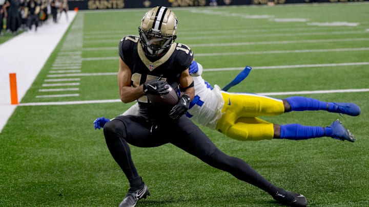 Dec 1, 2024; New Orleans, Louisiana, USA; New Orleans Saints wide receiver Dante Pettis (17) scores a two point conversion against Los Angeles Rams cornerback Darious Williams (24) during the second half at Caesars Superdome. Dec 1, 2024; New Orleans, Louisiana, USA; New Orleans Saints wide receiver Dante Pettis (17) scores a two point conversion against Los Angeles Rams cornerback Darious Williams (24) during the second half at Caesars Superdome.