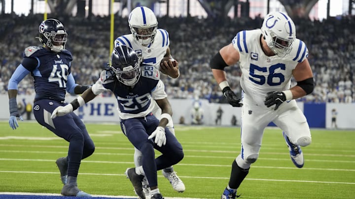 Dec 22, 2024; Indianapolis, Indiana, USA; Indianapolis Colts quarterback Anthony Richardson (5) rushes for a touchdown behind Indianapolis Colts guard Quenton Nelson (56) during a game against the Tennessee Titans at Lucas Oil Stadium. Mandatory Credit: Christine Tannous/USA Today Network via Imagn Images 