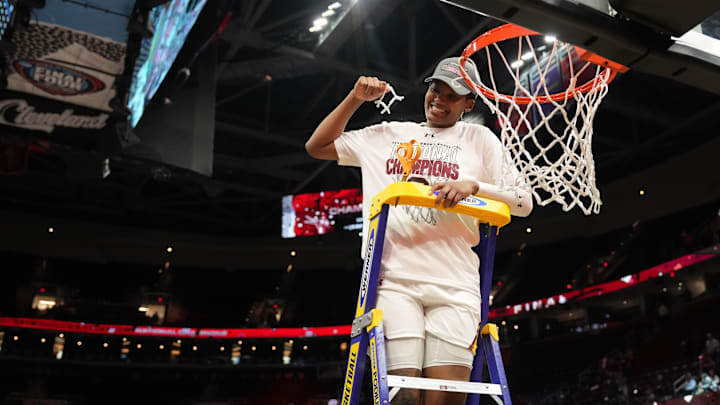 South Carolina basketball forward Sania Feagin cutting down the nets following the 2023-2024 National Championship