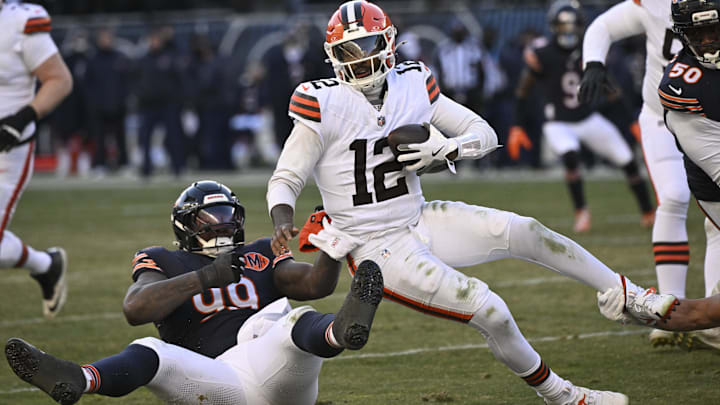Gervon Dexter makes one of five Bears sacks of Shedeur Sanders on Sunday in a 31-3 win.