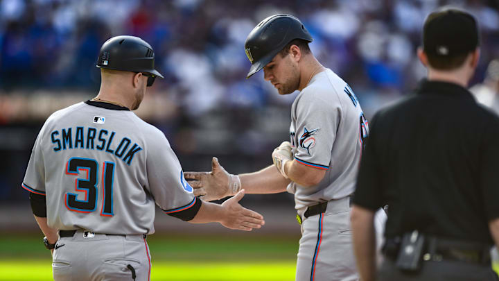 Aug 30, 2025; New York City, New York, USA; Miami Marlins outfielder Jakob Marsee (87) is greeted by first base coach Tyler Smarslok (31) after hitting a RBI single against the New York Mets during the third inning at Citi Field. Aug 30, 2025; New York City, New York, USA; Miami Marlins outfielder Jakob Marsee (87) is greeted by first base coach Tyler Smarslok (31) after hitting a RBI single against the New York Mets during the third inning at Citi Field.