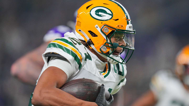 Green Bay Packers cornerback Carrington Valentine (24) runs with the ball after his interception against Minnesota Vikings.
