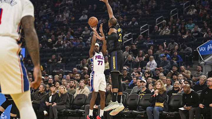 Feb 3, 2026; San Francisco, California, USA; Philadelphia 76ers guard Vj Edgecombe (77) shoots a three point basket over Golden State Warriors center Al Horford (20) during the first period at Chase Center. Mandatory Credit: Justine Willard-Imagn Images