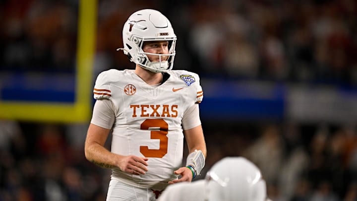 Jan 10, 2025; Arlington, TX, USA; Texas Longhorns quarterback Quinn Ewers (3) in action during the game between the Texas Longhorns and the Ohio State Buckeyes at AT&T Stadium. Mandatory Credit: Jerome Miron-Imagn Images