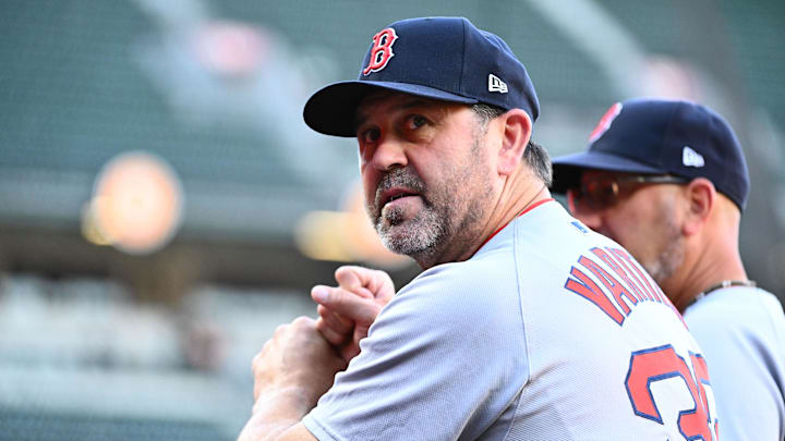 Aug 27, 2025; Baltimore, Maryland, USA;  Boston Red Sox game planning and run prevention coach Jason Varitek (33) stands in the dugout before the game between the Baltimore Orioles and the Boston Red Sox at Oriole Park at Camden Yards. Mandatory Credit: James A. Pittman-Imagn Images