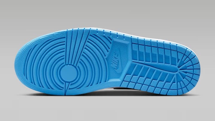 The Air Jordan 1 Low "Midnight Navy University Blue" colorway. The Air Jordan 1 Low "Midnight Navy University Blue" colorway.