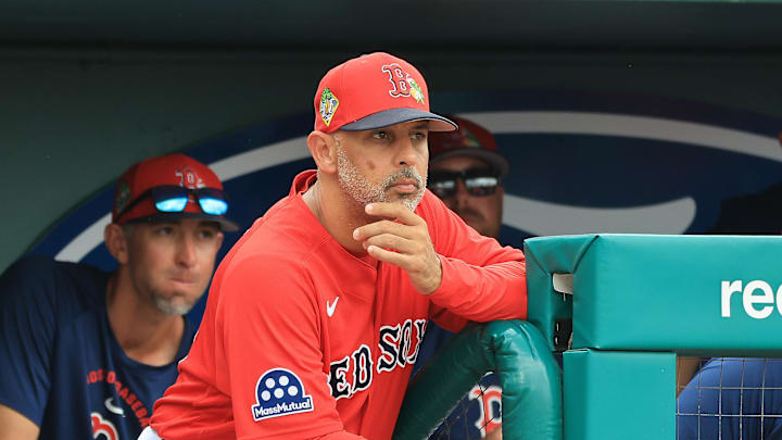 Feb 22, 2026; Fort Myers, Florida, USA; Boston Red Sox manager Alex Cora (13) looks on from the dugout during the third inning against the Toronto Blue Jays  at JetBlue Park at Fenway South. Mandatory Credit: Kim Klement Neitzel-Imagn Images
