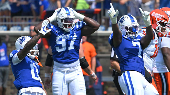 Sep 6, 2025; Durham, North Carolina, USA; Duke Blue Devils cornerback Chandler Rivers (0), linebacker Jaiden Francois (2) and cornerback Kimari Robinson (5) celebrate a tackle by defensive end Vincent Anthony Jr.'s (7) against the Illinois Fighting Illini during the first quarter at Wallace Wade Stadium. Mandatory Credit: Zachary Taft-Imagn Images Sep 6, 2025; Durham, North Carolina, USA; Duke Blue Devils cornerback Chandler Rivers (0), linebacker Jaiden Francois (2) and cornerback Kimari Robinson (5) celebrate a tackle by defensive end Vincent Anthony Jr.'s (7) against the Illinois Fighting Illini during the first quarter at Wallace Wade Stadium. Mandatory Credit: Zachary Taft-Imagn Images