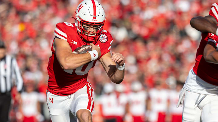 Nebraska quarterback Heinrich Haarberg rushes for a 5-yard touchdown in the first quarter against Wisconsin. Nebraska quarterback Heinrich Haarberg rushes for a 5-yard touchdown in the first quarter against Wisconsin.