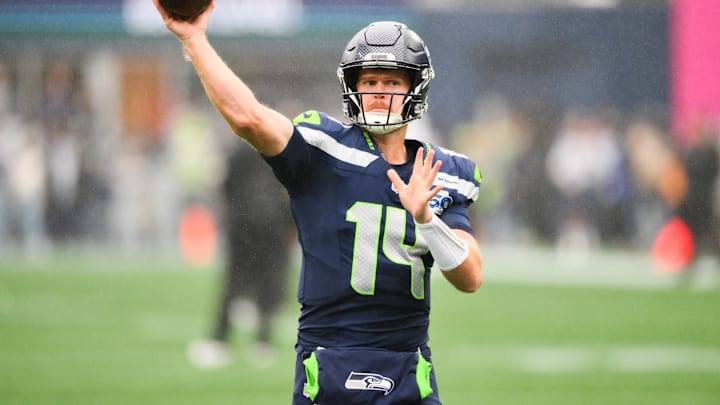 Sep 21, 2025; Seattle, Washington, USA; Seattle Seahawks quarterback Sam Darnold (14) warms up before the game against the New Orleans Saints at Lumen Field. 