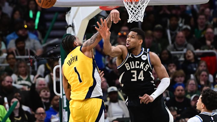 Apr 27, 2025; Milwaukee, Wisconsin, USA: Milwaukee Bucks forward Giannis Antetokounmpo (34) and Indiana Pacers forward Obi Toppin (1) reach for the ball in the third quarter during game four of first round for the 2024 NBA Playoffs at Fiserv Forum. Mandatory Credit: Benny Sieu-Imagn Images Apr 27, 2025; Milwaukee, Wisconsin, USA: Milwaukee Bucks forward Giannis Antetokounmpo (34) and Indiana Pacers forward Obi Toppin (1) reach for the ball in the third quarter during game four of first round for the 2024 NBA Playoffs at Fiserv Forum. Mandatory Credit: Benny Sieu-Imagn Images
