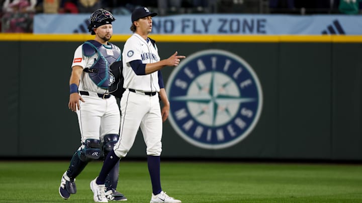 Seattle Mariners catcher Cal Raleigh (left) and starting pitcher Logan Gilbert walk before a game against the Athletics on March 27 at T-Mobile Park. Seattle Mariners catcher Cal Raleigh (left) and starting pitcher Logan Gilbert walk before a game against the Athletics on March 27 at T-Mobile Park.