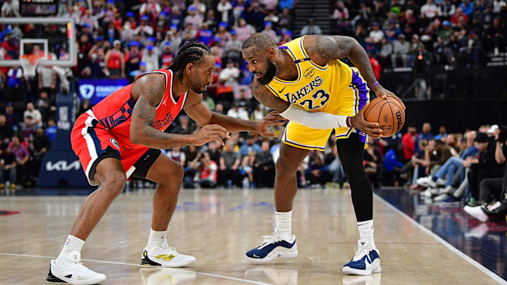 Feb 4, 2025; Inglewood, California, USA; Los Angeles Lakers forward LeBron James (23) controls the ball against Los Angeles Clippers forward Kawhi Leonard (2) during the second half at Intuit Dome. Mandatory Credit: Gary A. Vasquez-Imagn Images