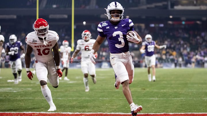 Dec 26, 2024; Phoenix, AZ, USA; Kansas State Wildcats running back Dylan Edwards (3) runs for a touchdown against the Rutgers Scarlet Knights during the second half of the Rate Bowl at Chase Field. Mandatory Credit: Mark J. Rebilas-Imagn Images