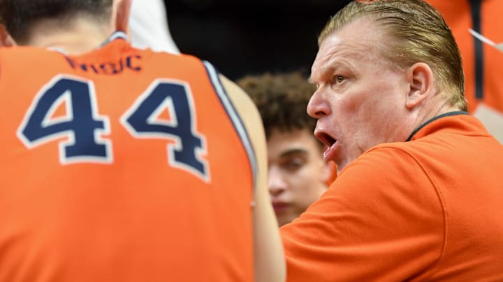 Illinois Fighting Illini head coach Brad Underwood leads a team huddle Saturday, March 21, 2026, during the NCAA Men’s Basketball Tournament second round game against the VCU Rams at Bon Secours Wellness Arena in Greenville, South Carolina.