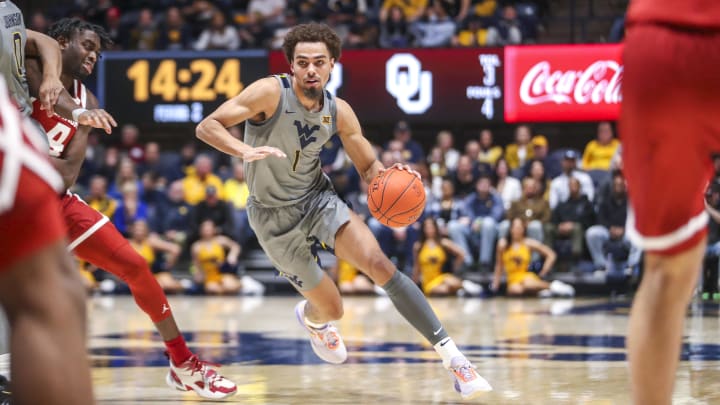 Feb 4, 2023; Morgantown, West Virginia, USA; West Virginia Mountaineers forward Emmitt Matthews Jr. (1) dribbles during the second half against the Oklahoma Sooners at WVU Coliseum. 