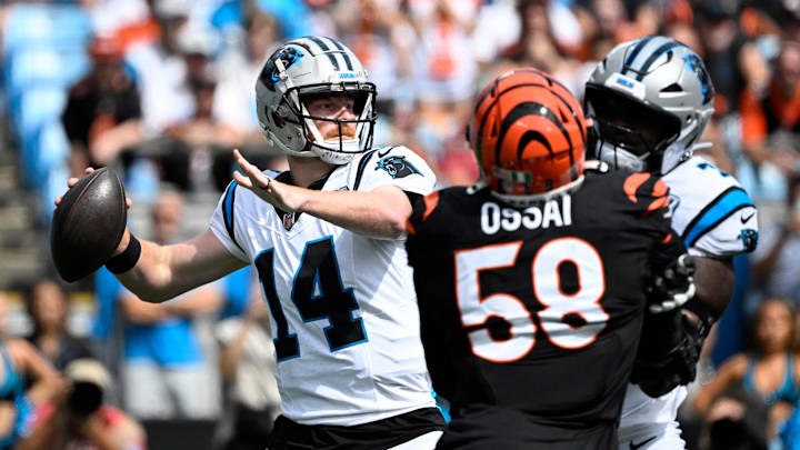 Sep 29, 2024; Charlotte, North Carolina, USA; Carolina Panthers quarterback Andy Dalton (14) looks to pass as Cincinnati Bengals defensive end Joseph Ossai (58) pressures in the first quarter at Bank of America Stadium. Mandatory Credit: Bob Donnan-Imagn Images