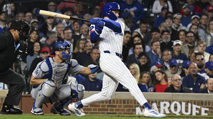 Apr 23, 2025; Chicago, Illinois, USA;  Chicago Cubs outfielder Pete Crow-Armstrong (4) hits an RBI single against the Los Angeles Dodgers during the fifth inning at Wrigley Field.