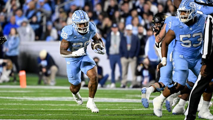 Nov 16, 2024; Chapel Hill, North Carolina, USA; North Carolina Tar Heels running back Omarion Hampton (28) runs in the first quarter at Kenan Memorial Stadium. Mandatory Credit: Bob Donnan-Imagn Images Nov 16, 2024; Chapel Hill, North Carolina, USA; North Carolina Tar Heels running back Omarion Hampton (28) runs in the first quarter at Kenan Memorial Stadium. Mandatory Credit: Bob Donnan-Imagn Images