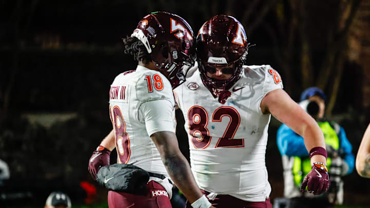 Nov 23, 2024; Durham, North Carolina, USA; Virginia Tech quarterback William Watson III (18) and tight end Benji Gosnell (82)  celebrate a touchdown during the second half of the game against Duke.
