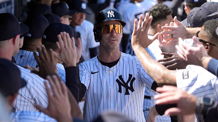 Feb 21, 2025; Tampa, Florida, USA; New York Yankees outfielder Cody Bellinger (35) is congratulated in the dugout after scoring against the Tampa Bay Rays during the first inning at George M. Steinbrenner Field. Mandatory Credit: Dave Nelson-Imagn Images
