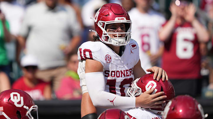 Oklahoma quarterback John Mateer celebrates a 51-yard rushing touchdown. Oklahoma quarterback John Mateer celebrates a 51-yard rushing touchdown.