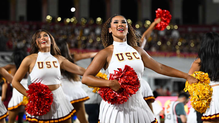 Sep 7, 2024; Los Angeles, California, USA; USC Trojan cheerleaders dance in the game against the Utah State Aggies during the first quarter at United Airlines Field at Los Angeles Memorial Coliseum.