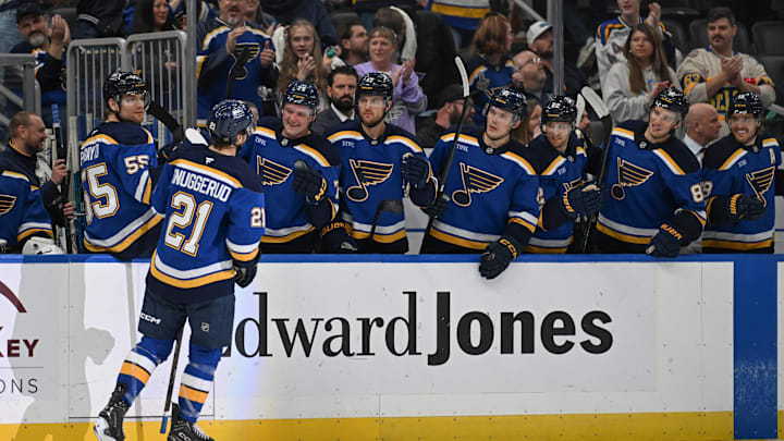 Apr 13, 2026; St. Louis, Missouri, USA; St. Louis Blues right wing Jimmy Snuggerud (21) is congratulated after scoring an empty net goal against the Minnesota Wild in the third period at Enterprise Center. Mandatory Credit: Joe Puetz-Imagn Images Apr 13, 2026; St. Louis, Missouri, USA; St. Louis Blues right wing Jimmy Snuggerud (21) is congratulated after scoring an empty net goal against the Minnesota Wild in the third period at Enterprise Center. Mandatory Credit: Joe Puetz-Imagn Images